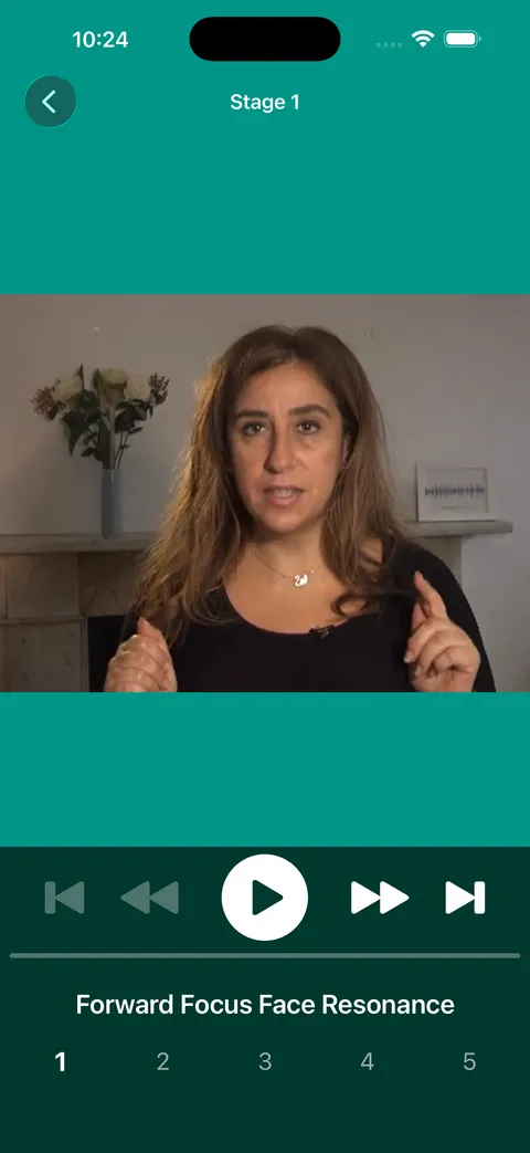 Christella Antoni speaking to camera in a Stage 1 lesson called Forward Focus Face Resonance, with playback controls.